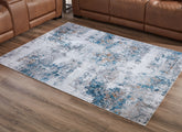 Elite Furniture Outlet - Ashley Furniture - Garyard Rug - 5' x 7' Washable Rug / Multi - R405772
