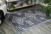 Elite Furniture Outlet - Ashley Furniture - Arloman Rug - 5' x 7' Washable Rug / Black/Cream/Gray - R405932