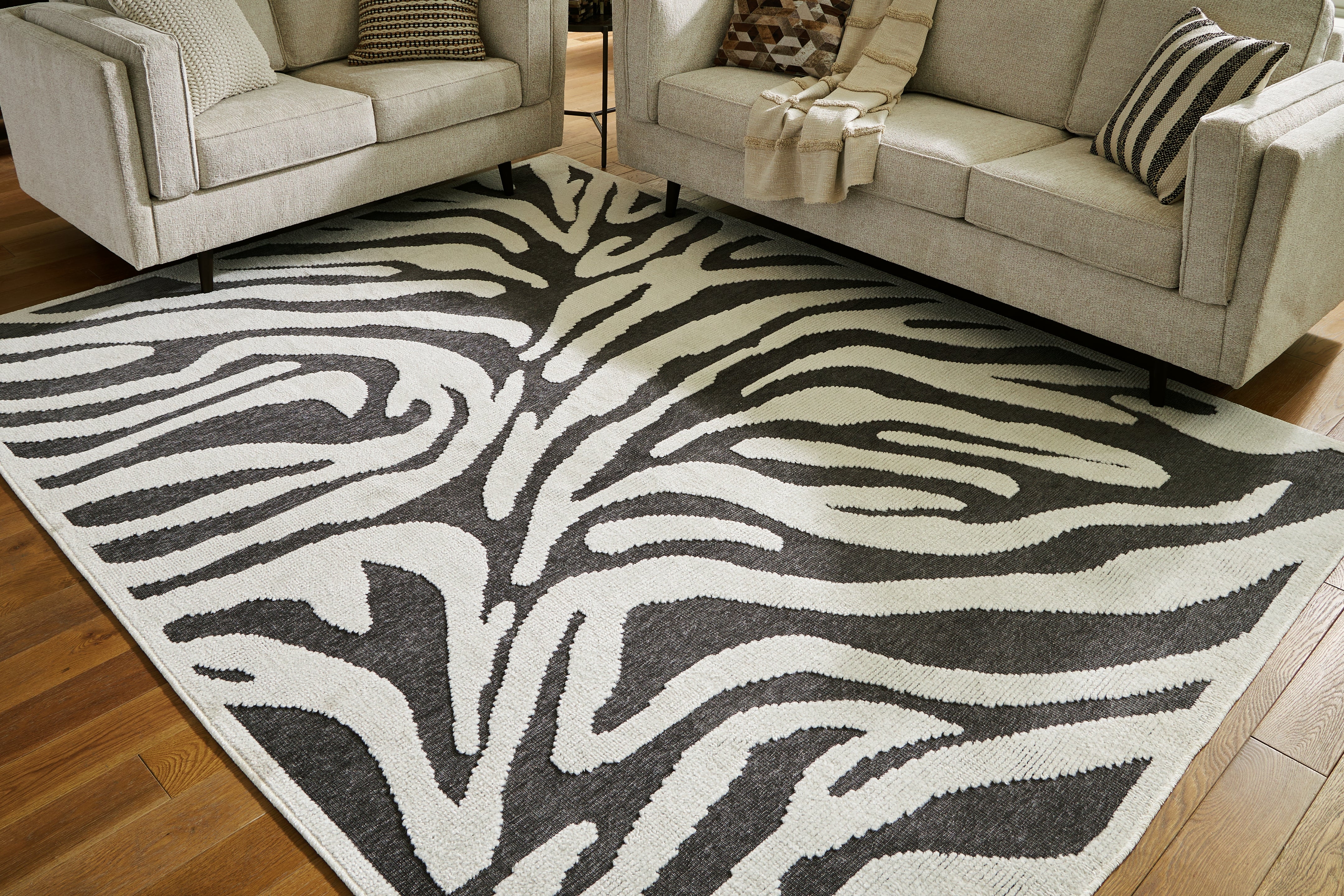 Elite Furniture Outlet - Ashley Furniture - Thomwith Rug - 8' x 10'2" Washable Rug / Black/Ivory - R406291