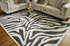 Elite Furniture Outlet - Ashley Furniture - Thomwith Rug - 8' x 10'2" Washable Rug / Black/Ivory - R406291