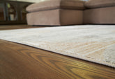 Elite Furniture Outlet - Ashley Furniture - Truward Rug - 5' x 7' Rug / Linen/Gray/Caramel - R406472