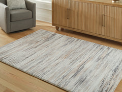 Elite Furniture Outlet - Ashley Furniture - Nace Rug - 7'6" x 9'6" Area Rug / Gray/Brown/White - R407471