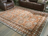 Elite Furniture Outlet - Ashley Furniture - Qaabiz Rug - 5' x 7' Area Rug / Sienna/Ivory/Black - R407522
