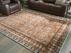 Elite Furniture Outlet - Ashley Furniture - Qaabiz Rug - 5' x 7' Area Rug / Sienna/Ivory/Black - R407522