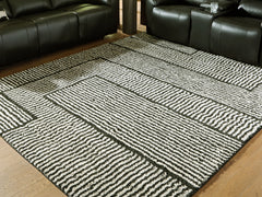 Elite Furniture Outlet - Ashley Furniture - Kurtmen Rug - 5' x 7' Area Rug / Black/Ivory - R407592