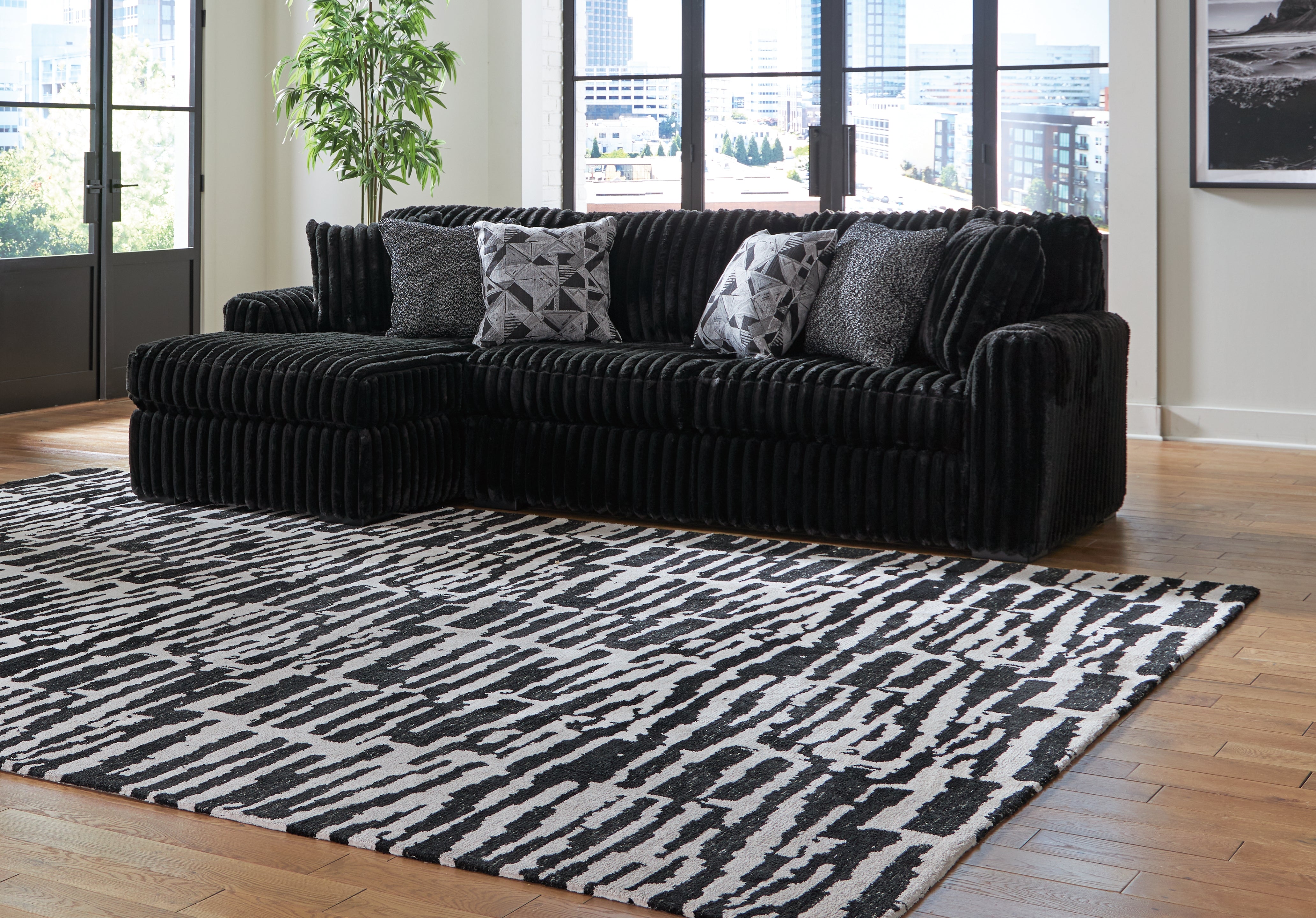 Elite Furniture Outlet - Ashley Furniture - Midnight-Madness Sectional - RAF 2-Piece Sectional Sofa with Chaise / Onyx - 98103S1