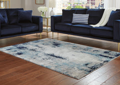 Elite Furniture Outlet - Ashley Furniture - Leonelle Rug - 7'10" x 10' Rug / White/Blue/Gray - R404871