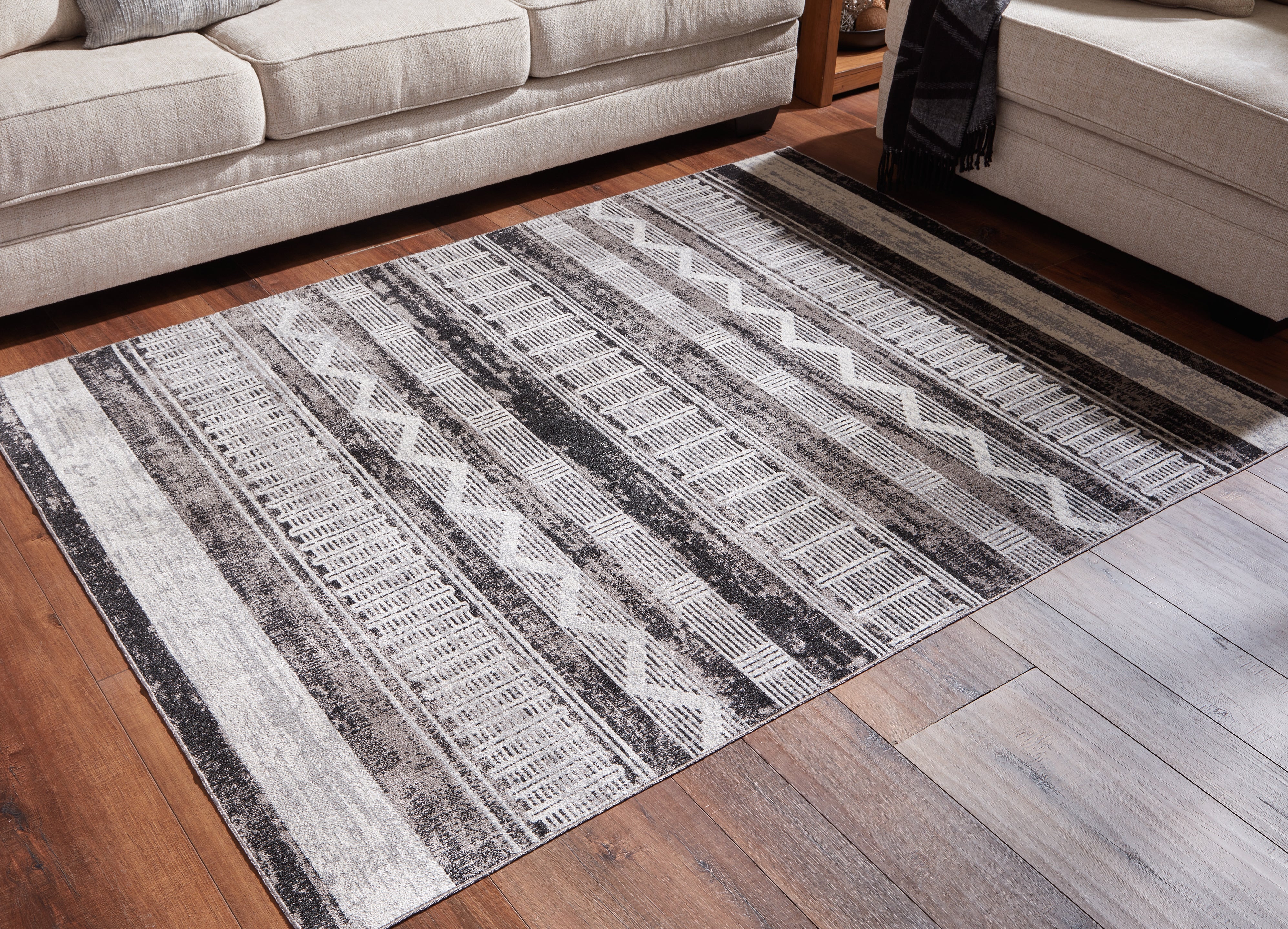 Elite Furniture Outlet - Ashley Furniture - Henchester Rug - 5' x 7' Washable Rug / Multi - R405992