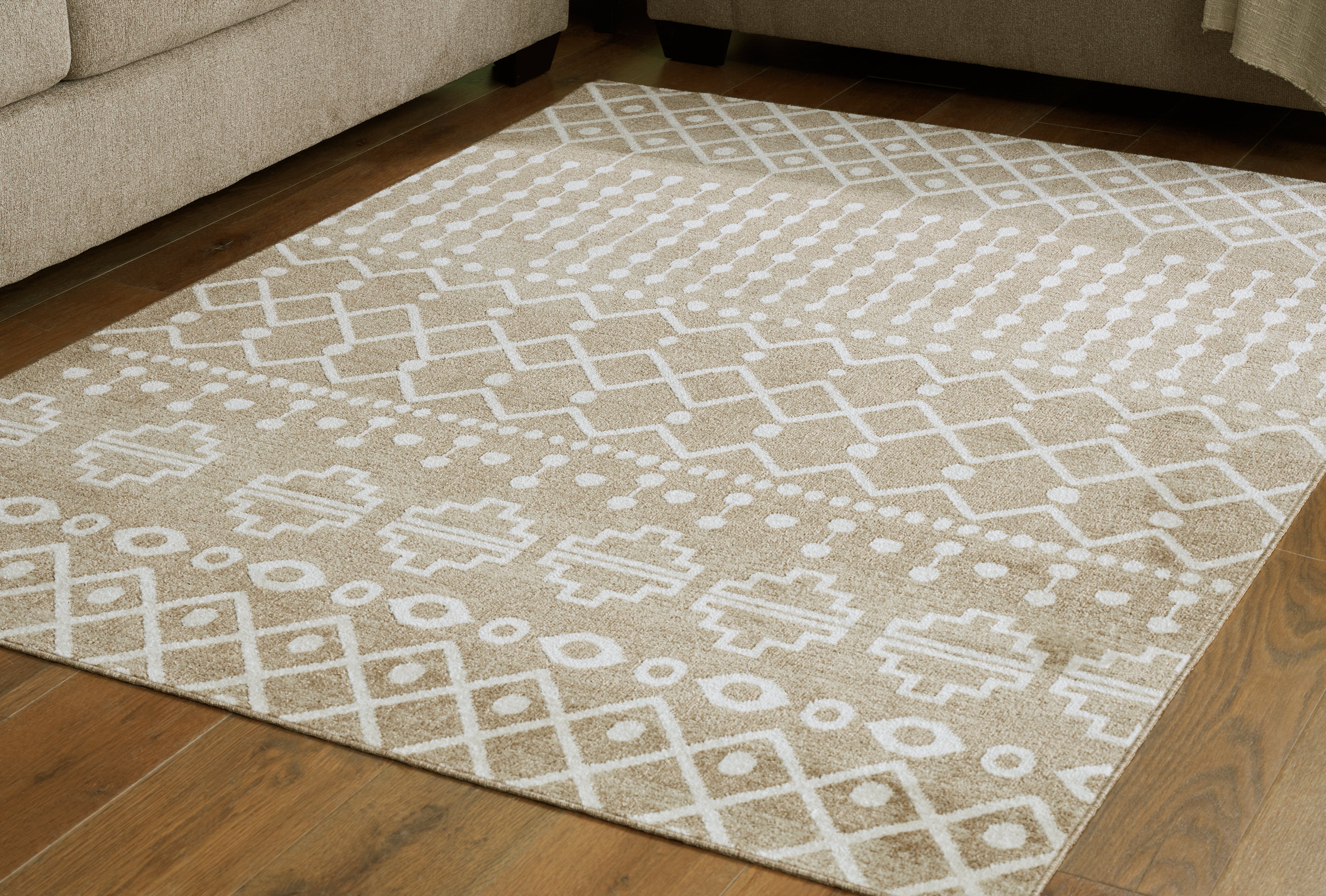Elite Furniture Outlet - Ashley Furniture - Bunchly Rug - 4'11" x 7'2" Washable Rug / Tan/Brown/Cream - R406222
