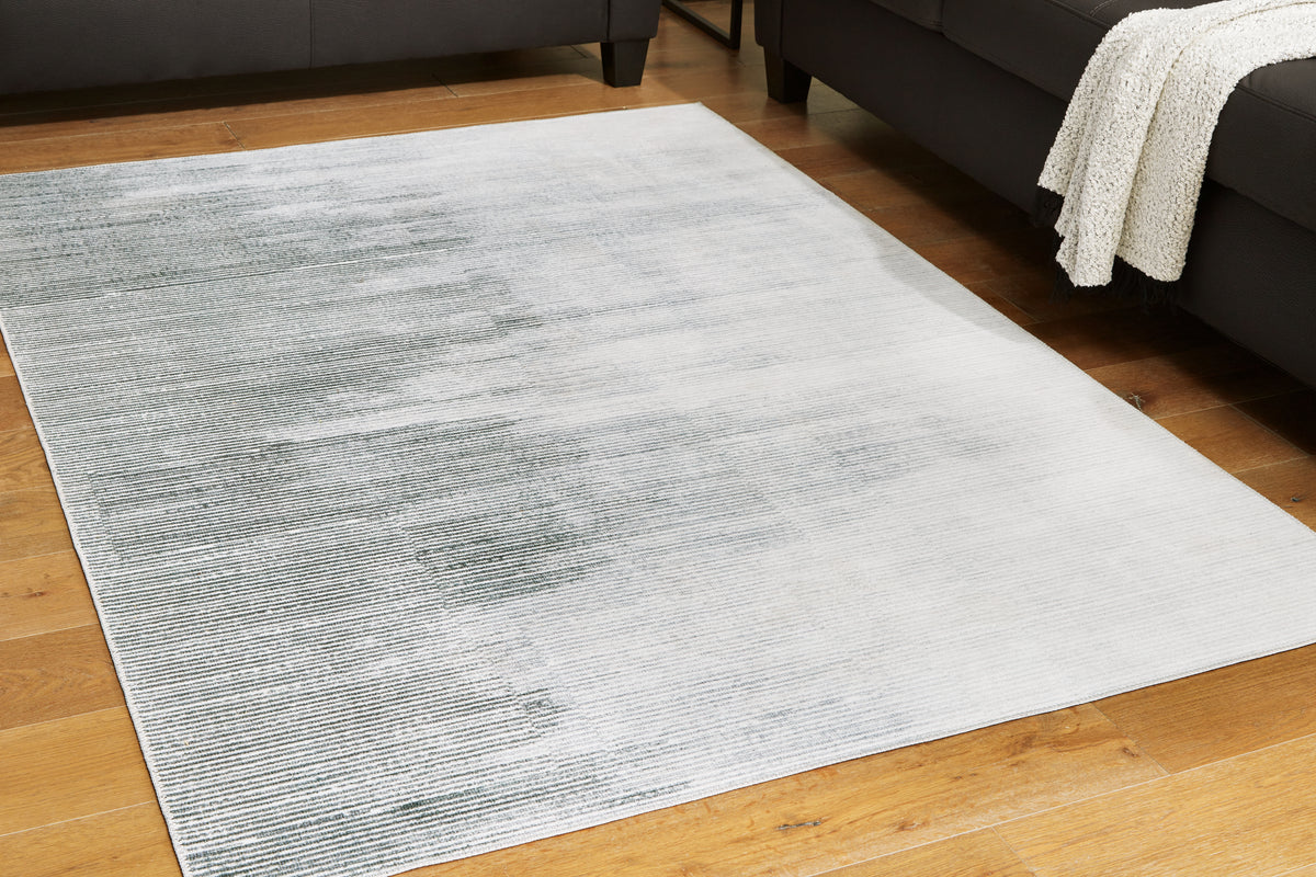 Elite Furniture Outlet - Ashley Furniture - Milset Rug - 8'1" x 10' Washable Rug / Black/White/Gray - R406251
