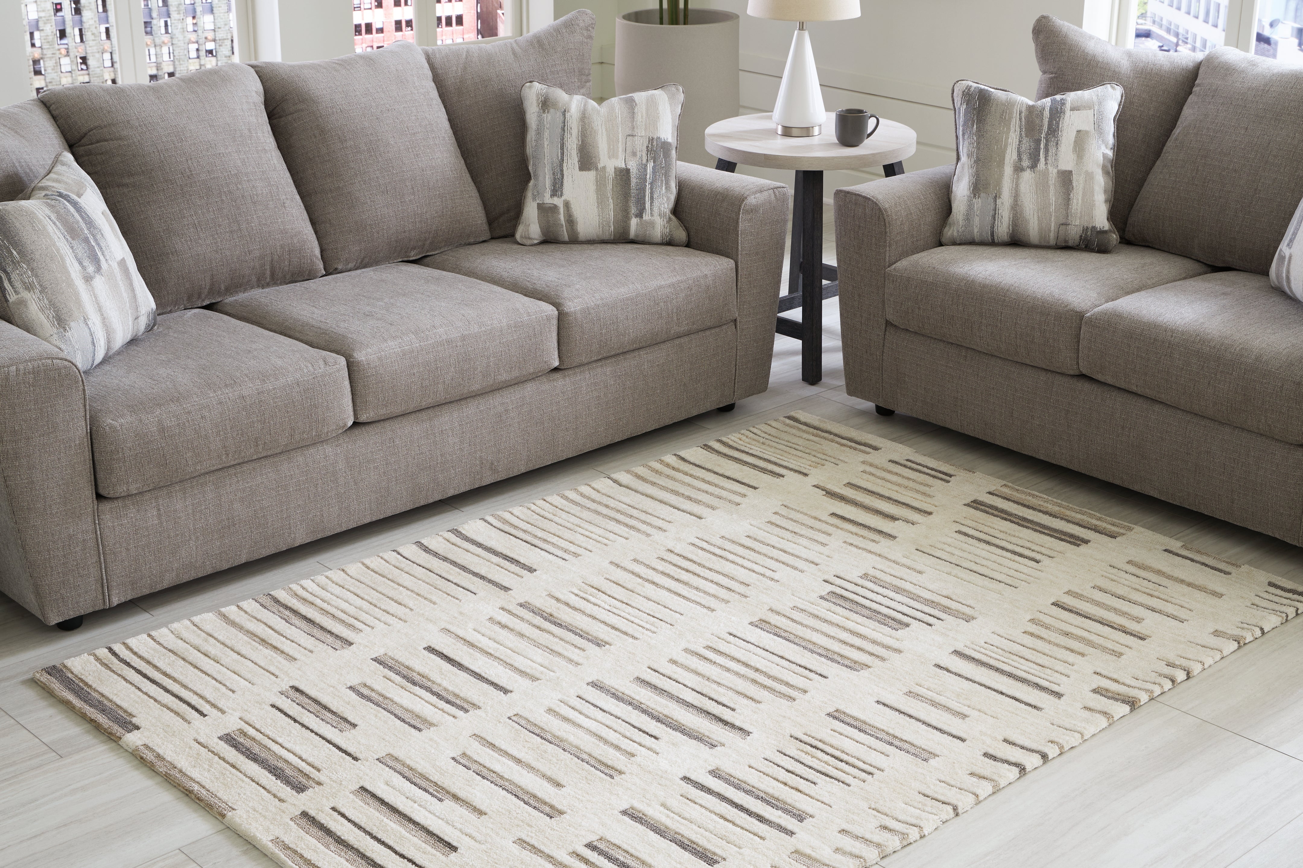 Elite Furniture Outlet - Ashley Furniture - Leesdale Rug - 5' x 7' Rug / Ivory/Brown/Black - R406422