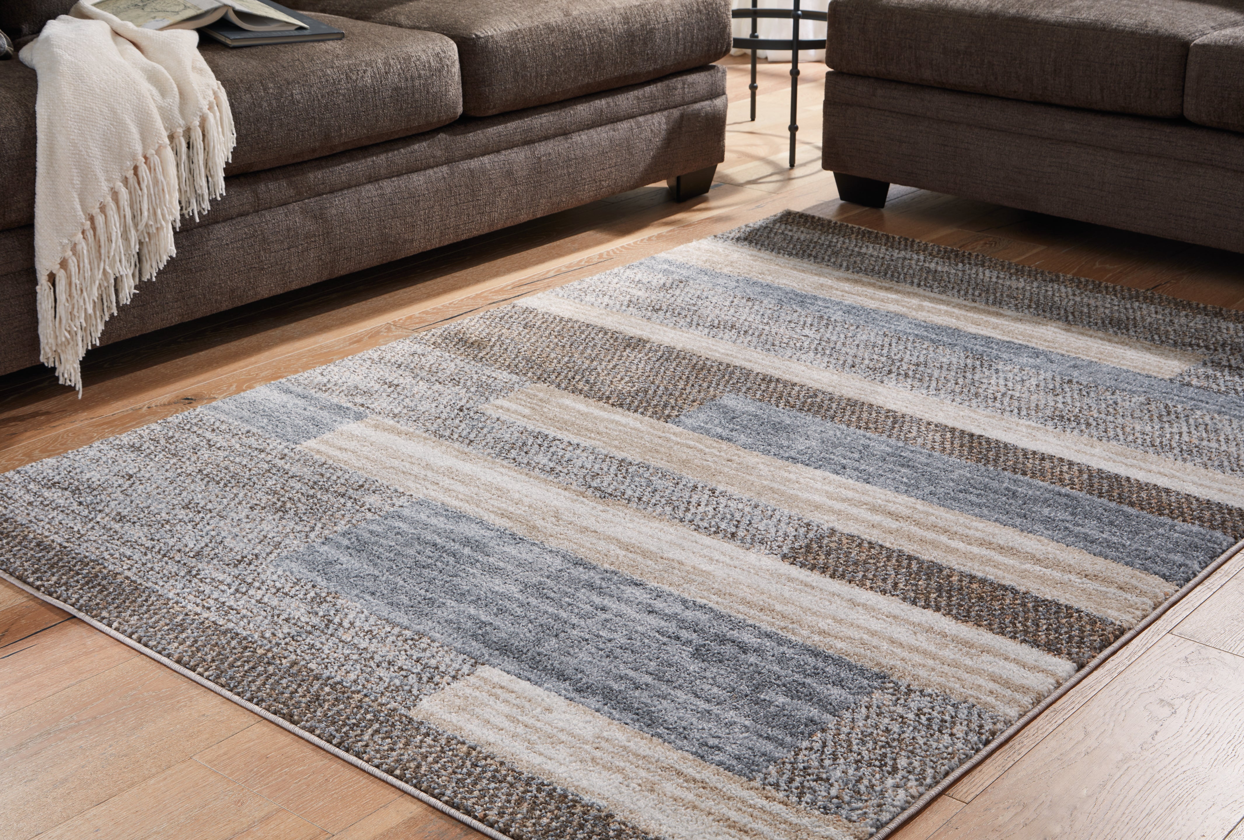Elite Furniture Outlet - Ashley Furniture - Sethburn Rug - 5' x 7' Rug / Cream/Brown/Gray - R406592