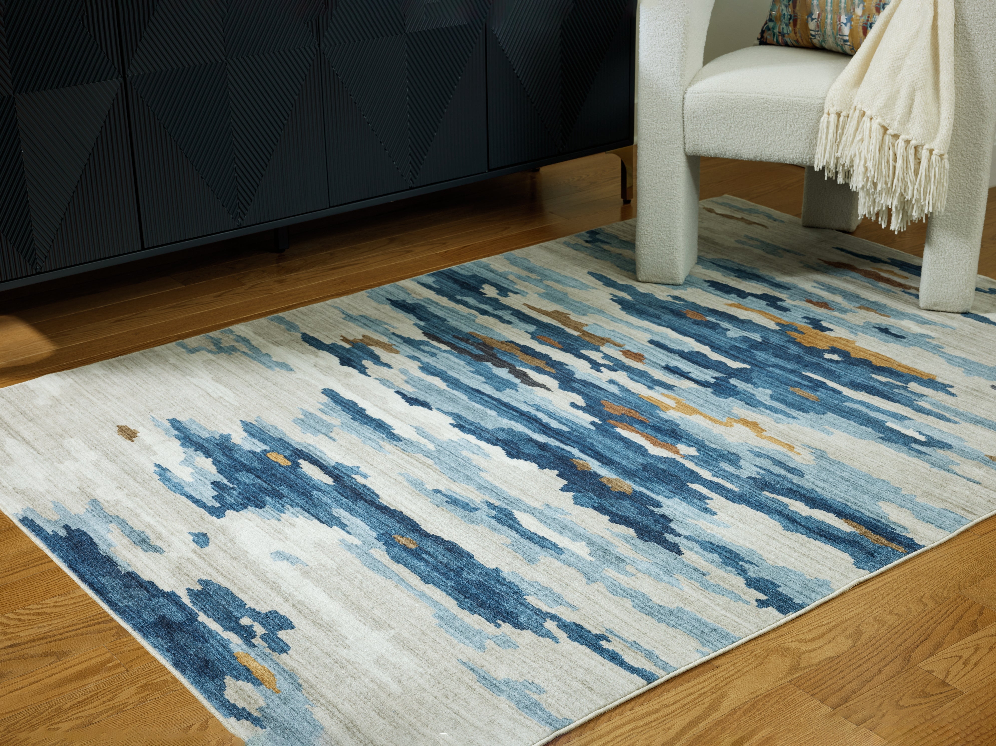 Elite Furniture Outlet - Ashley Furniture - Vinlett Rug - 5' x 7' Washable Rug / Cream/Blue/Brown - R407042