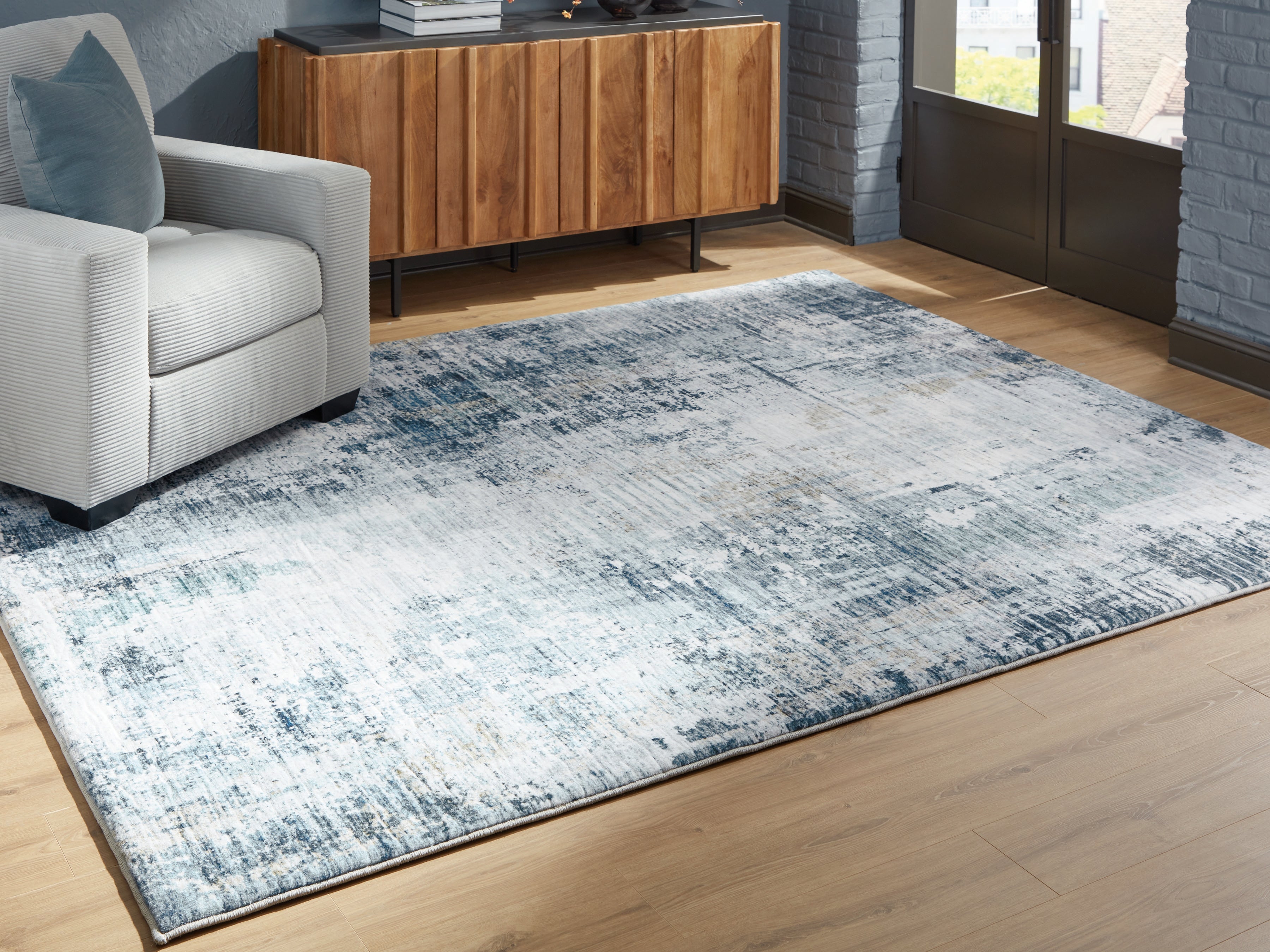 Elite Furniture Outlet - Ashley Furniture - Arlenmont Rug - 7'6" x 9'6" Area Rug / Blue/White/Brown - R407481