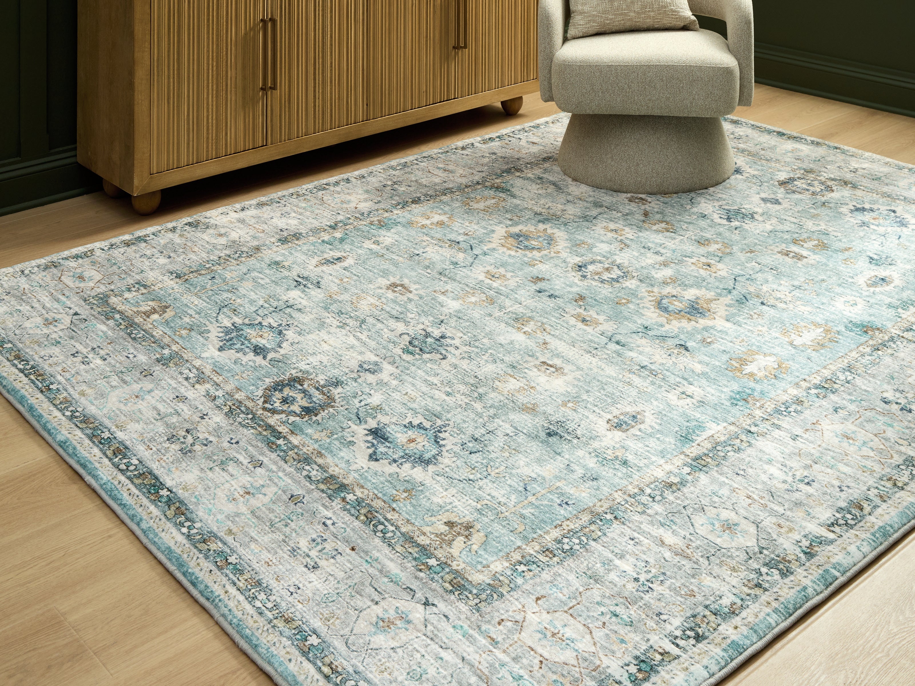 Elite Furniture Outlet - Ashley Furniture - Ladstoney Rug - 7'6" x 9'6" Area Rug / Teal/Beige/Ochre - R407501