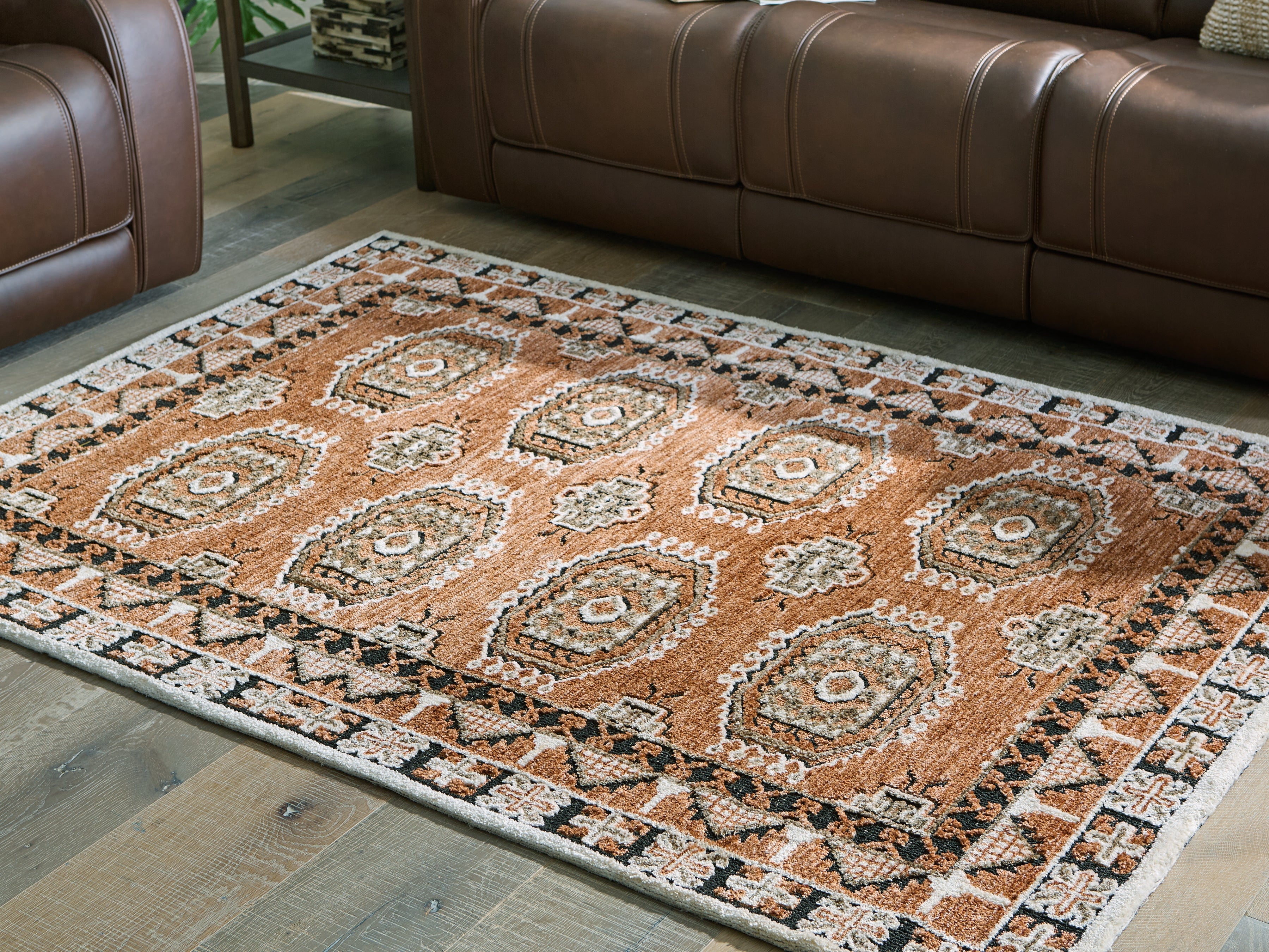 Elite Furniture Outlet - Ashley Furniture - Qaabiz Rug - 5' x 7' Area Rug / Sienna/Ivory/Black - R407522