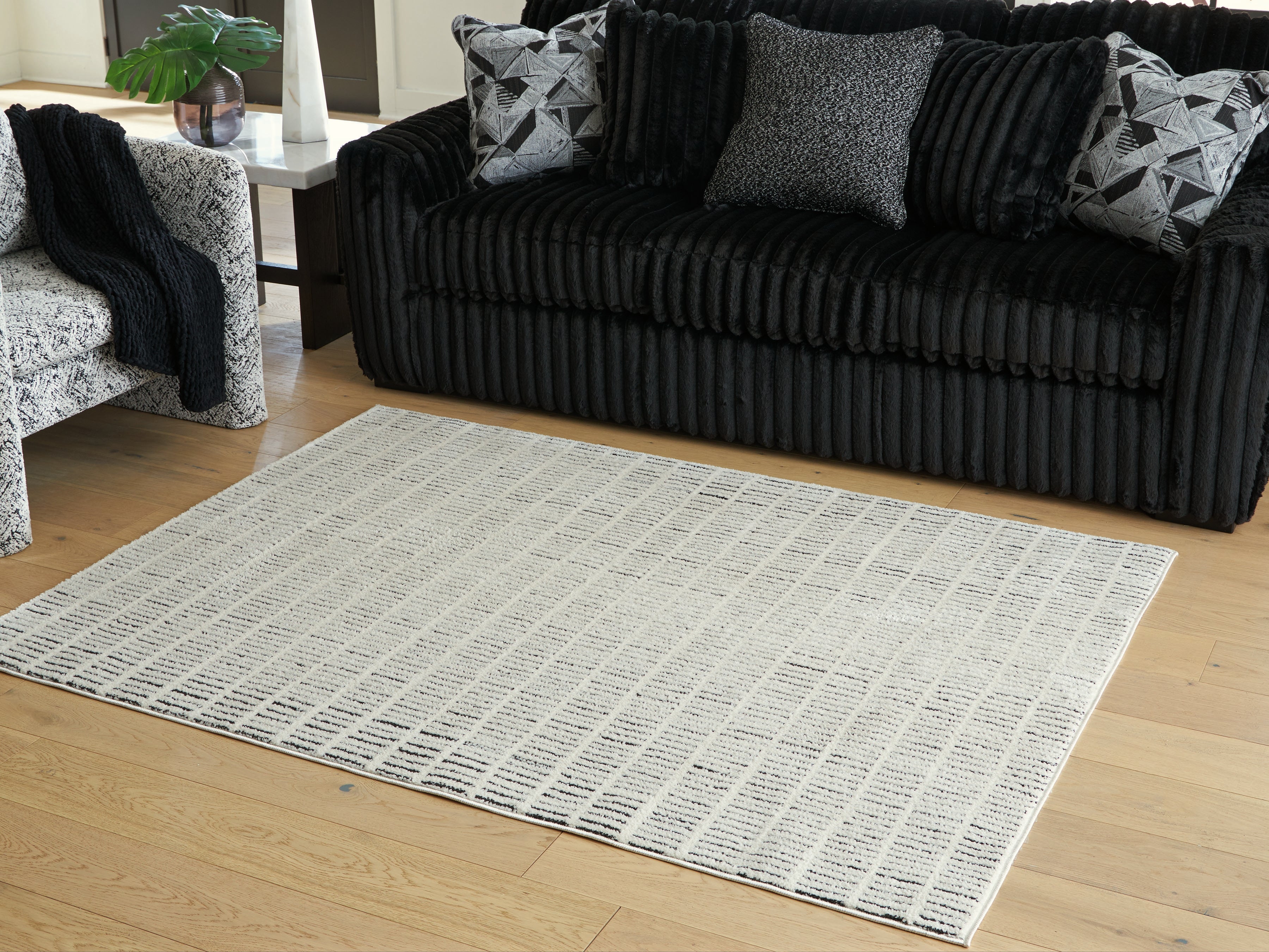 Elite Furniture Outlet - Ashley Furniture - Turinwith Rug - 5'3" x 7' Area Rug / Ivory/Black - R407552